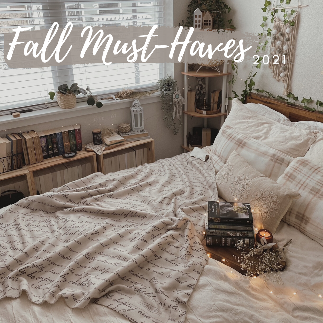 A cozy room with a blanket and books with the words "Fall Must-Haves" written on the top of the image.
